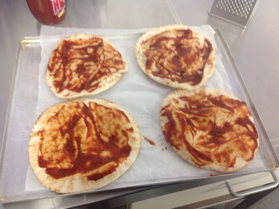 Put the tomato paste all over the pizza