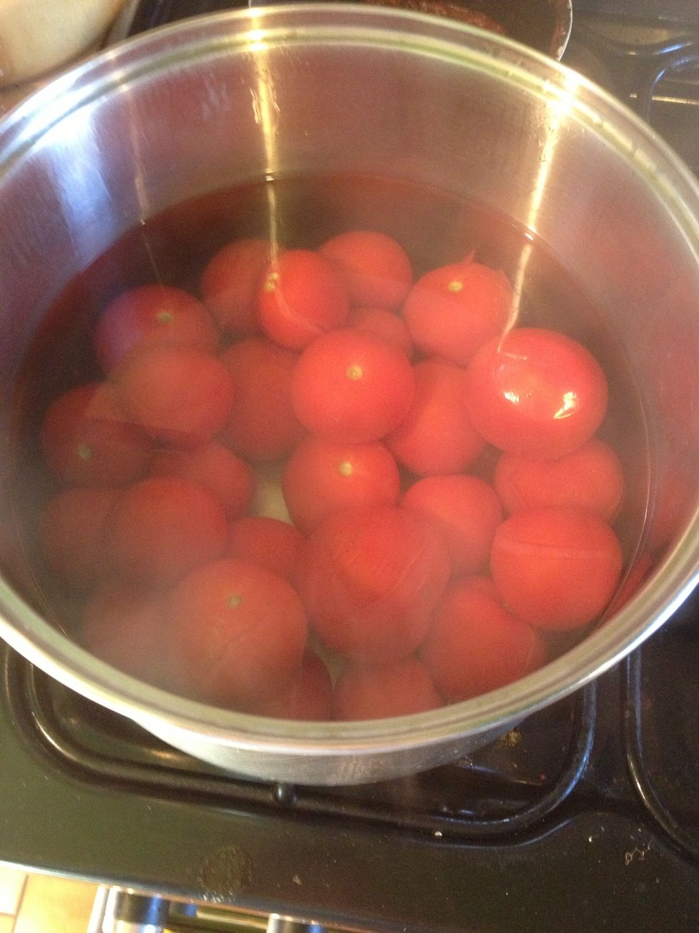 Put the tomatoes in a pan of boiling water for approximately 30 seconds.