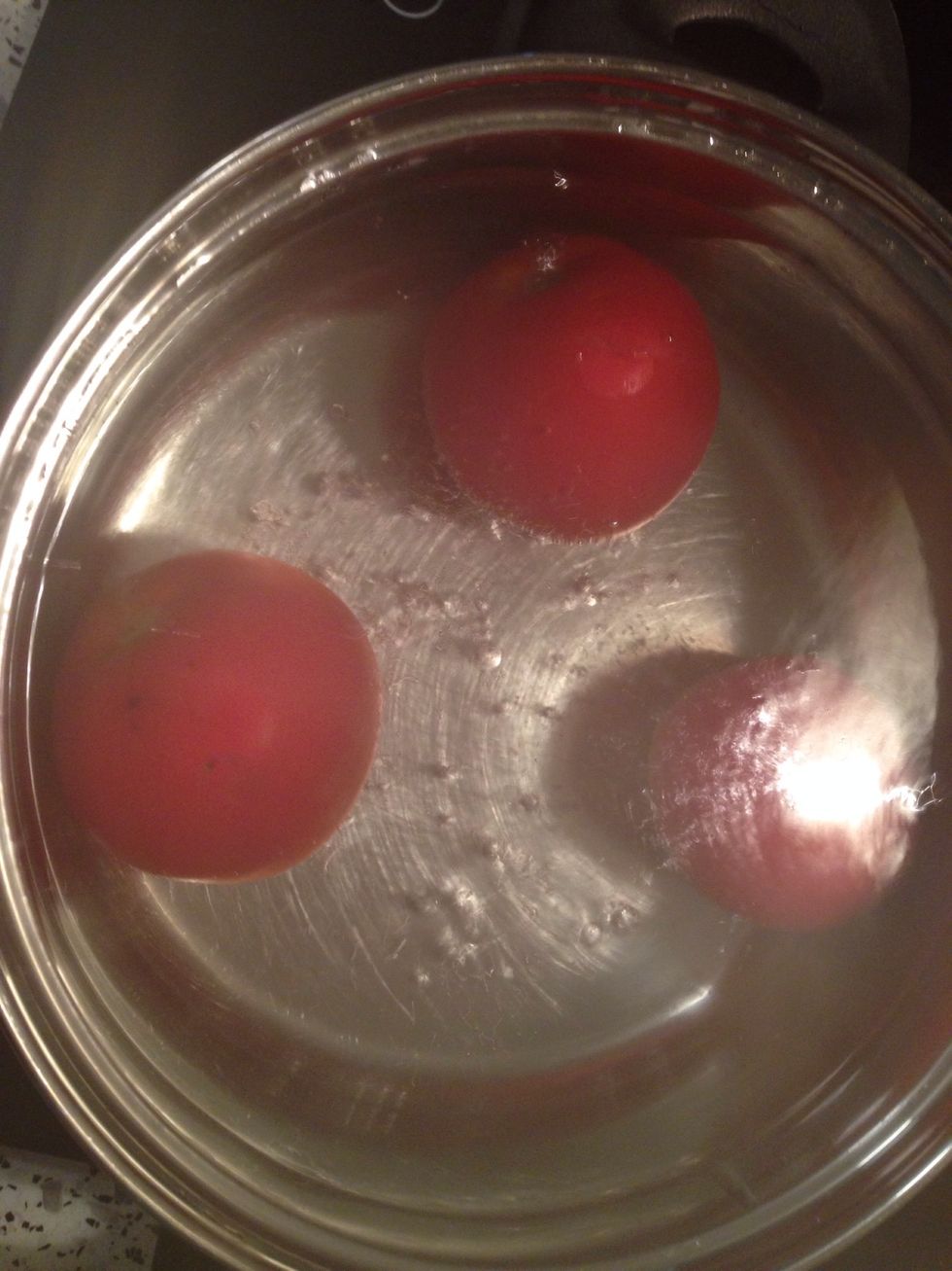 Put the tomatoes in boiling water.