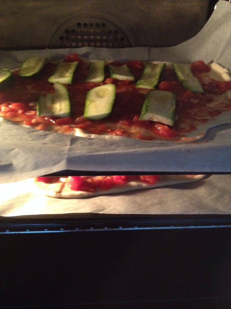 Put the Tomatosauce and the zucchini on the dough and then for 20 minutes in the oven ( about 150 degrees) . Enjoy your pizza!