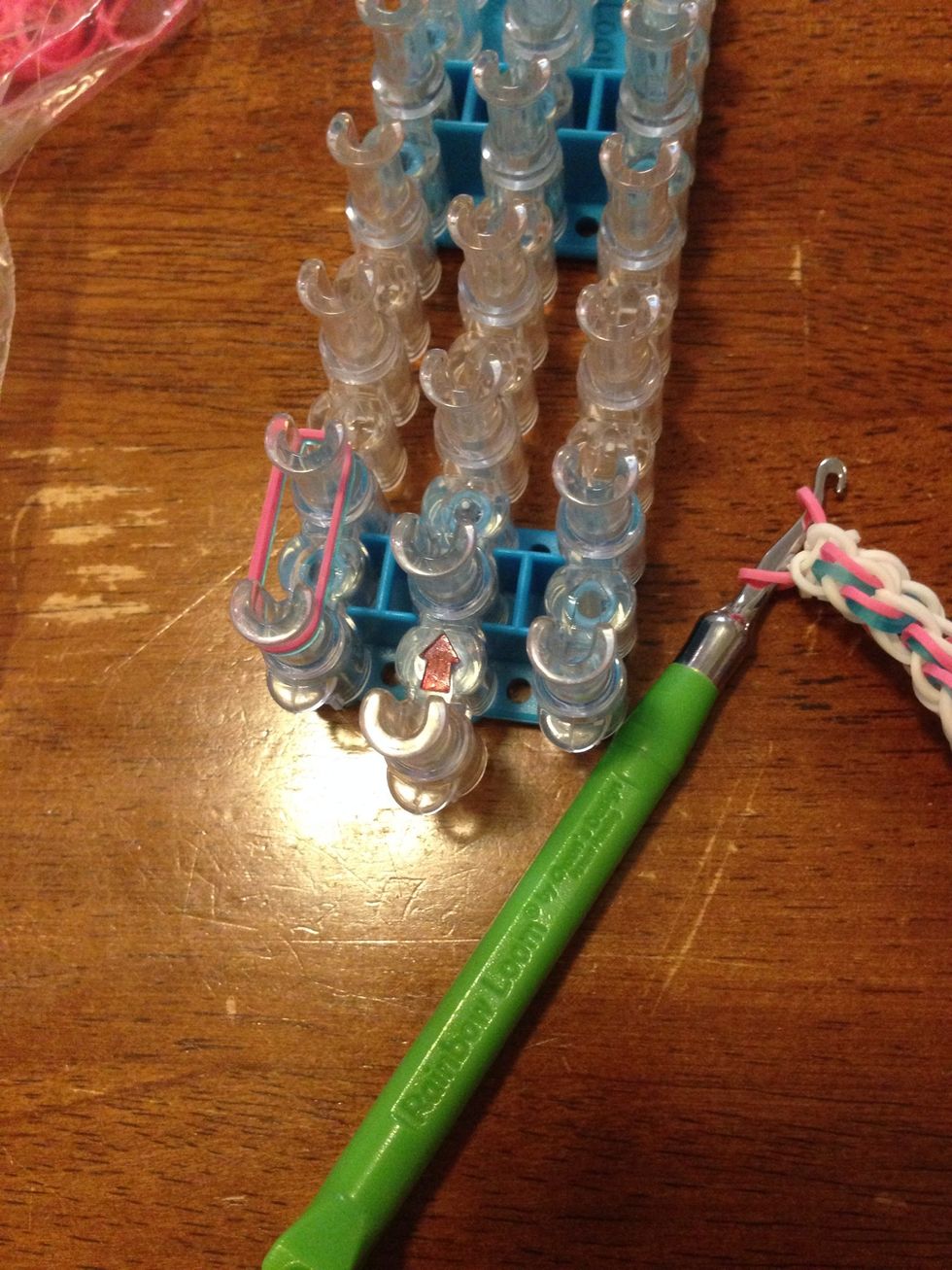 Put the two colours (or a single band) on the first left pin to the second left.