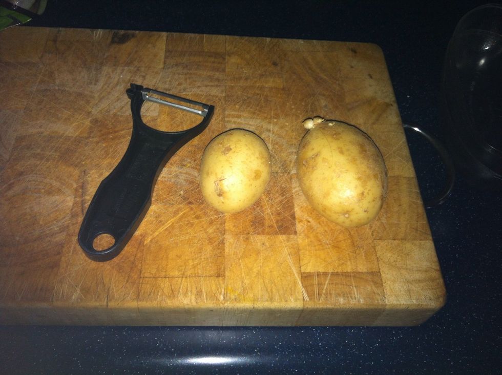 Put the two potatoes on the cutting board