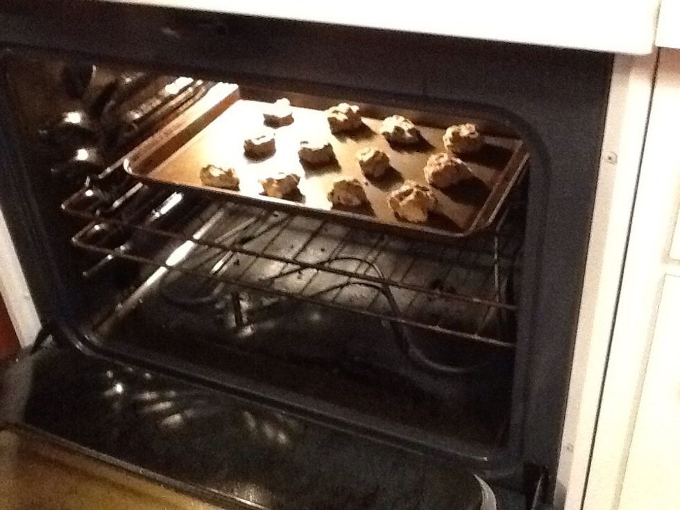 Put the uncooked cookies into the oven