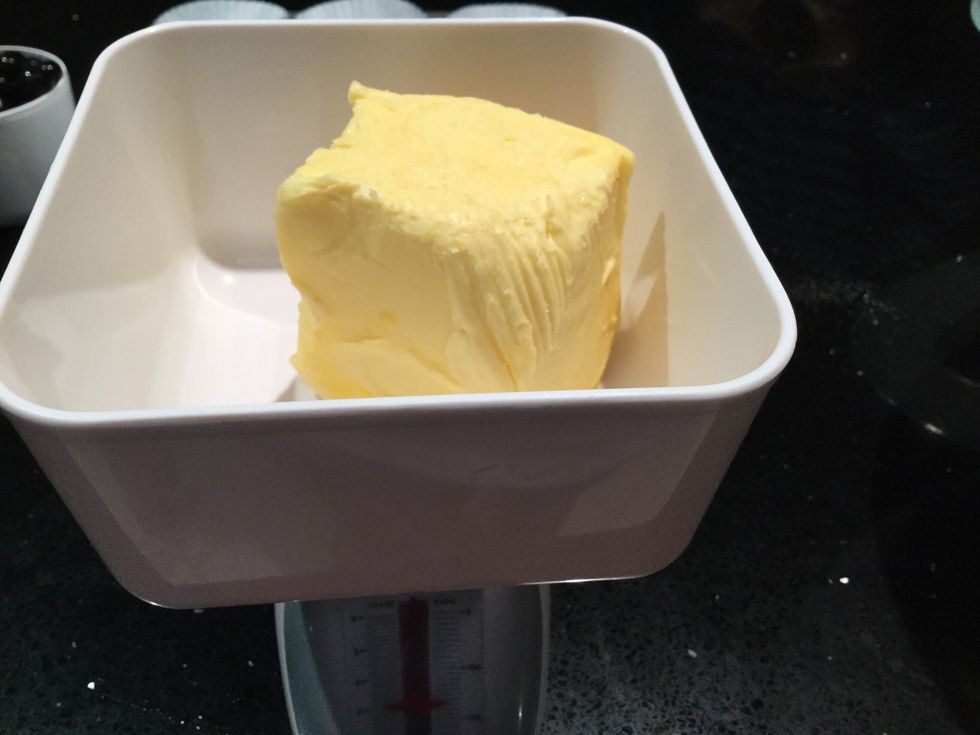 Put the unsalted butter into the scale and measure 90 grams