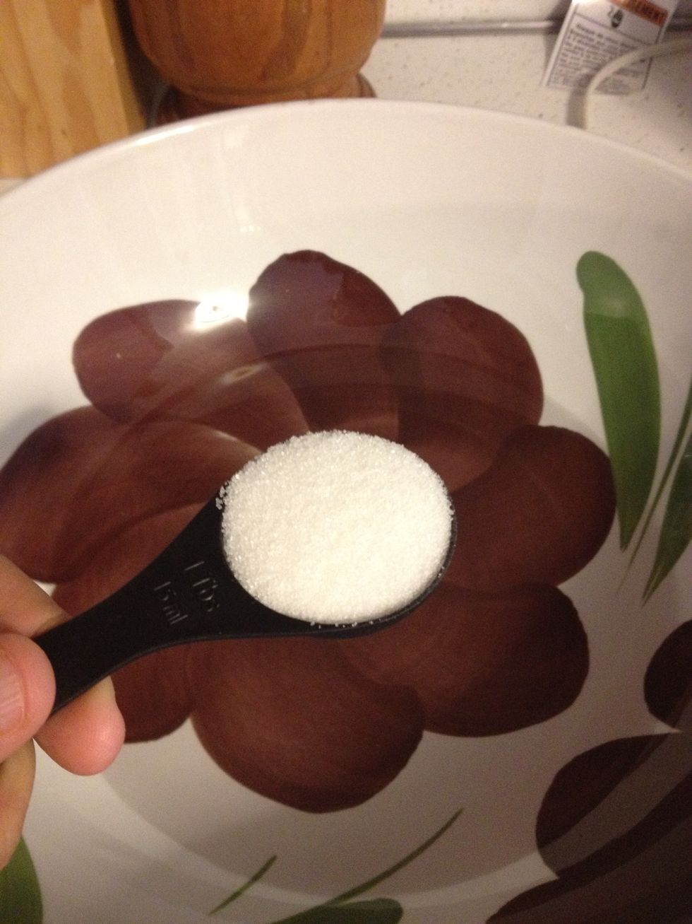 Put the warm water and sugar in a big bowl. A very BIG BOWL. A salad bowl works for me.