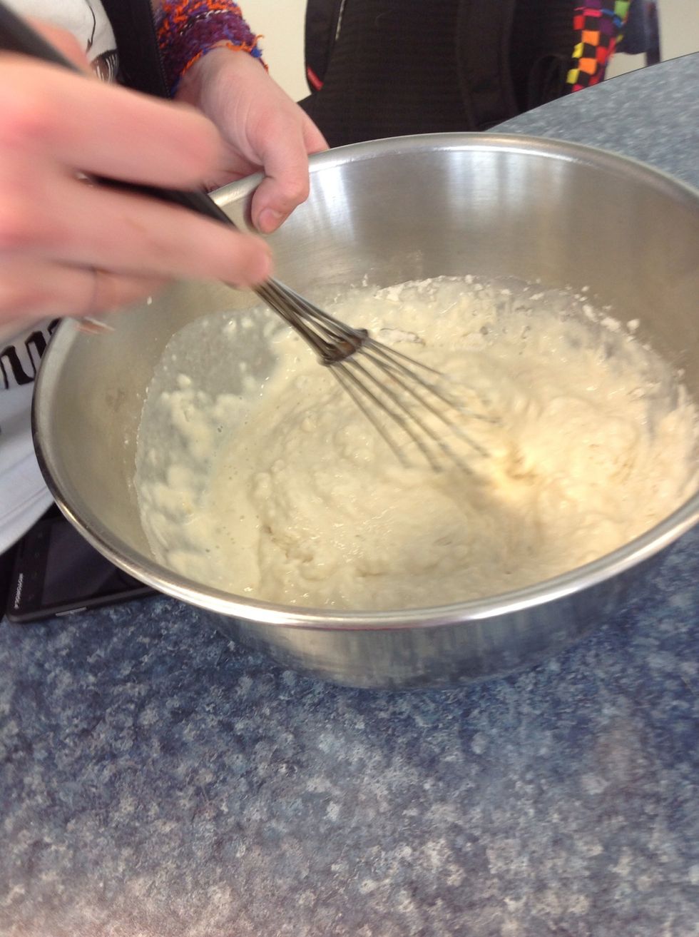 put the wet and dry ingredients together in the same bowl and stir them until they are combined and mixed and smooth'd out.