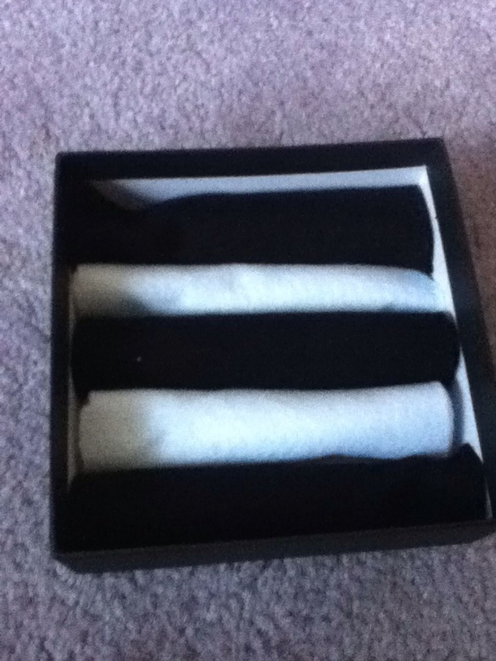Put them in as shown. I glued the bottoms down- but don't glue the sides of the rolls...those are where the rings go!