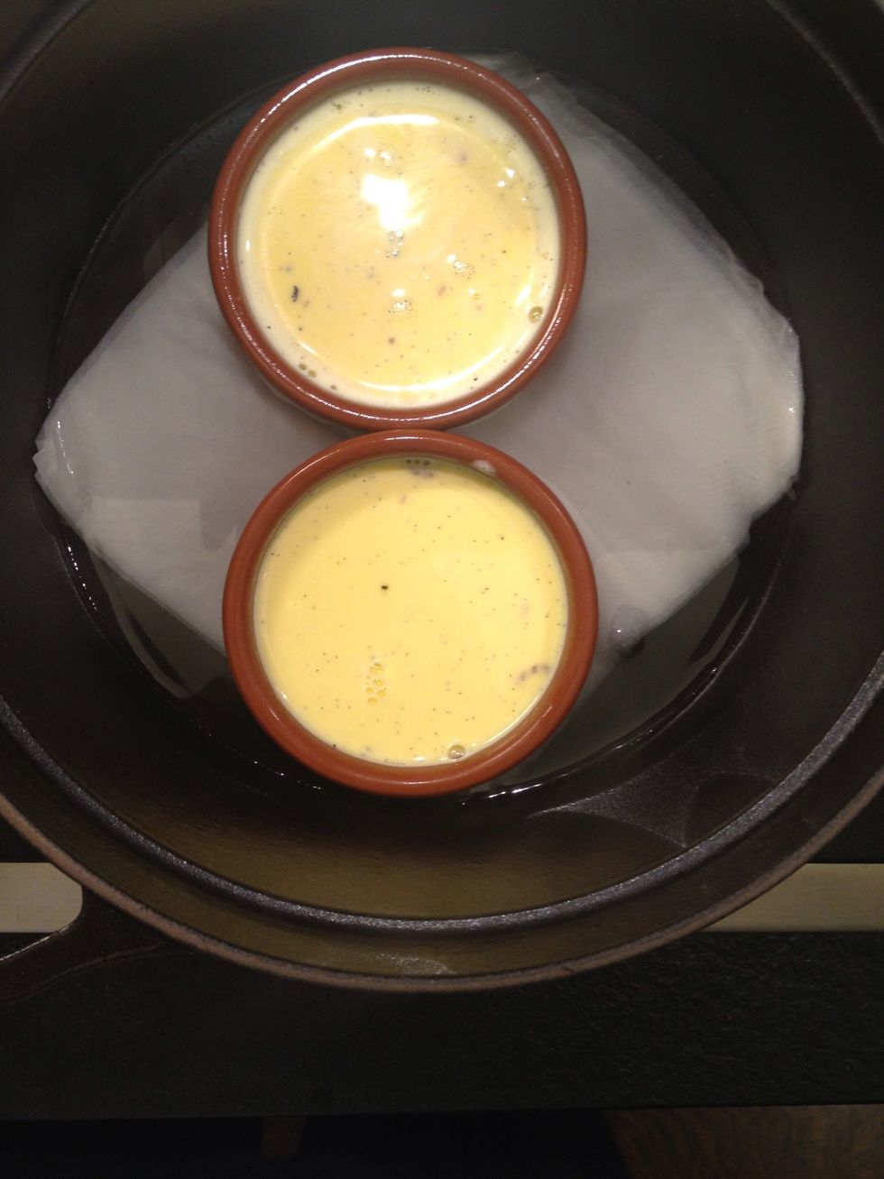 Put them in the baking tray or pot. If you are using a tray just cover with foil. It prevents the custard from creating a skin.