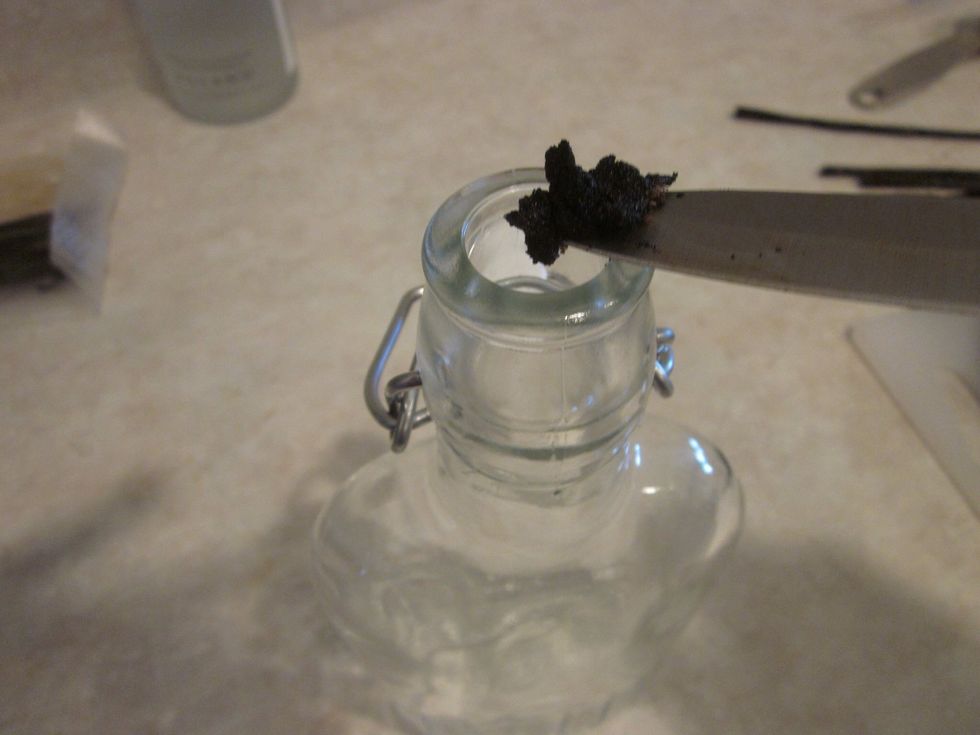 Put them in the bottle. It should be empty. If it is not perhaps you had a bit of the vodka and misread this guide.