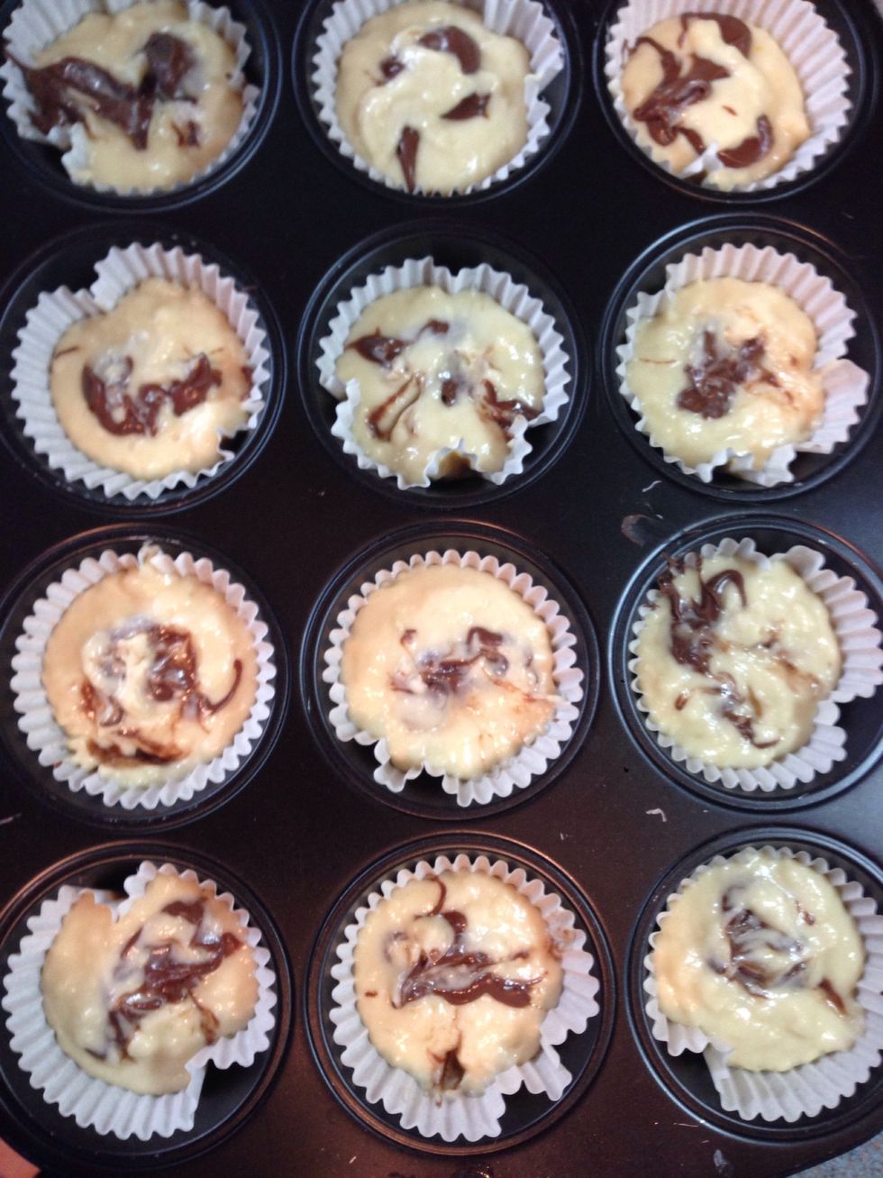 Put them in the cups and put some Nutella on each. Then use your finger to sink the Nutella inside it.