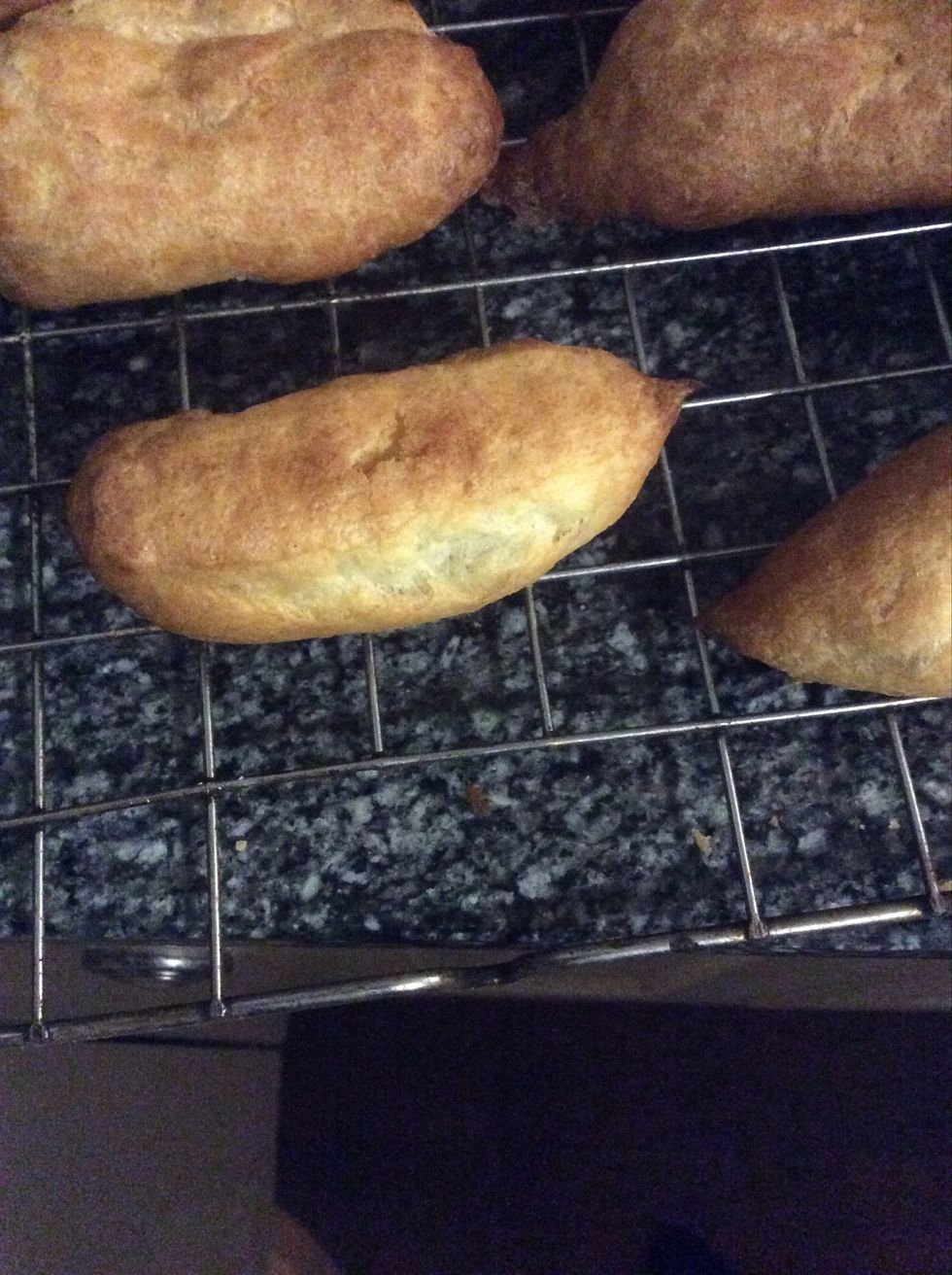 Put them in the oven at 220 degrees for 10 minutes then lower the temp to 200 for 10 minutes. After they have cooked put a small hole in the bottom to let any spare steam out
