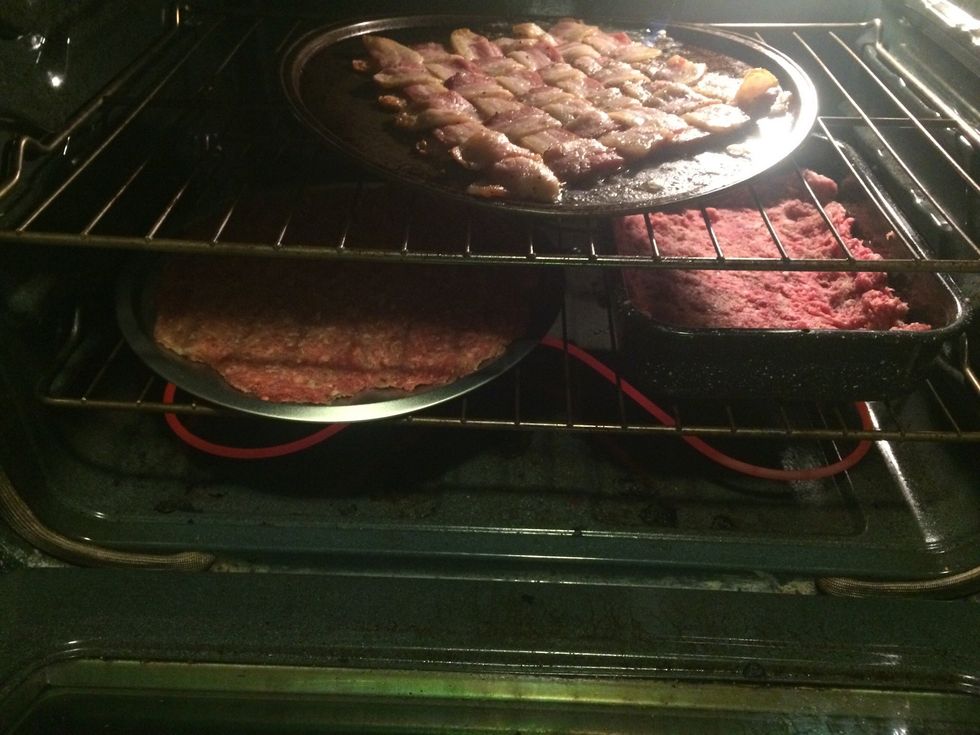 Put them in the oven at 400\u2022 and cook to medium done. Pull out the bacon weave when it's done and put it on time paper towels to drain.