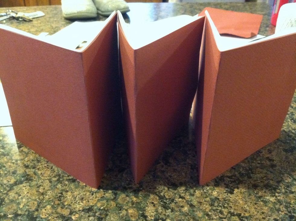 Put them into sections (bookbinders term is: signatures) signatures are a section or group of papers, this book has 3. I recommend an odd number of signatures, with no moe than 6 sheets in them