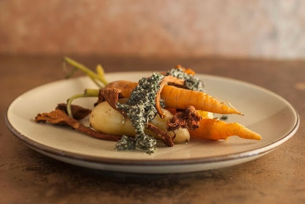 Put them on a plate, 2 small carrots, 2 fingering potatoes and a few of the Chanterelles  per person. Drizzle the seaweed pesto over the vegetables and serve them up.
