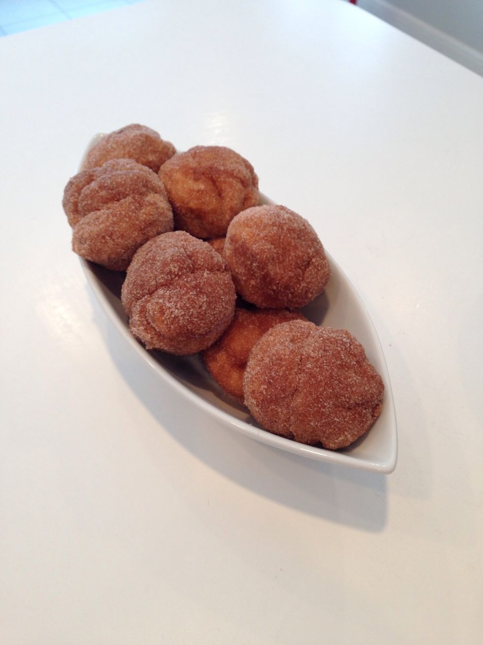 Put them out and watch them go. They are fabulous when they are still warm or at room temp. Theoretically, you could cool and freeze them before you dip and roll. Give you time to get to the gym.