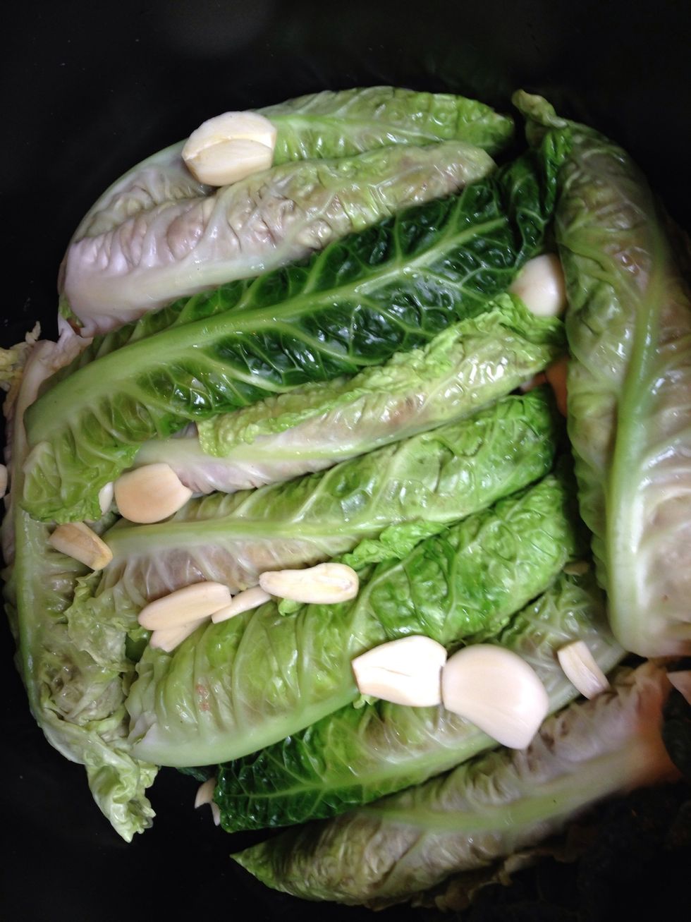 Put then in your casserole put the garlic, the juice of 3 lemons. The 30 grams of rice. ( this will help the sauce to thicken. Add few fresh mint leaves. Add the peeled garlic