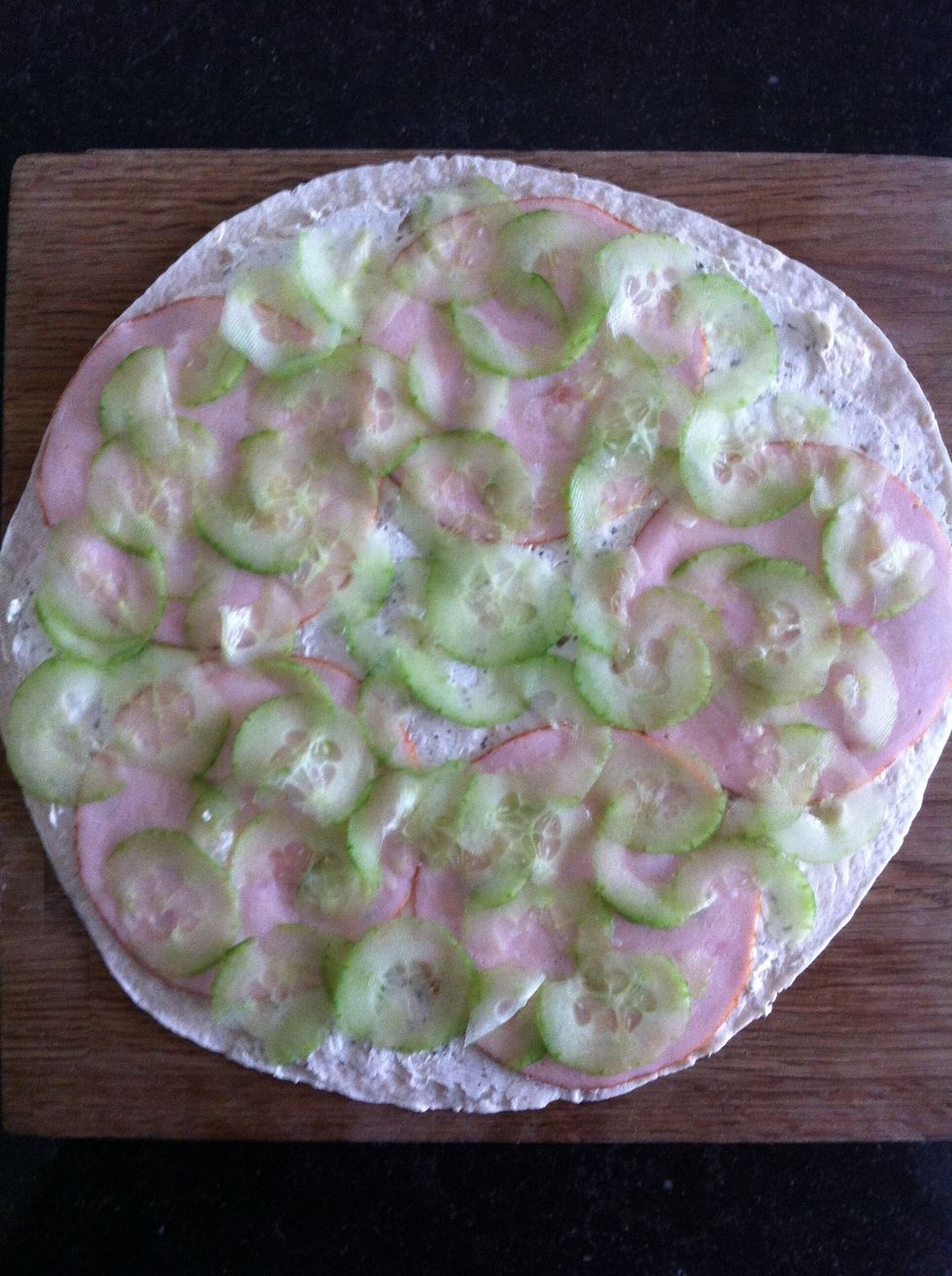 Put thin slices of cucumber on the wrap. Make sure they're not too thick!