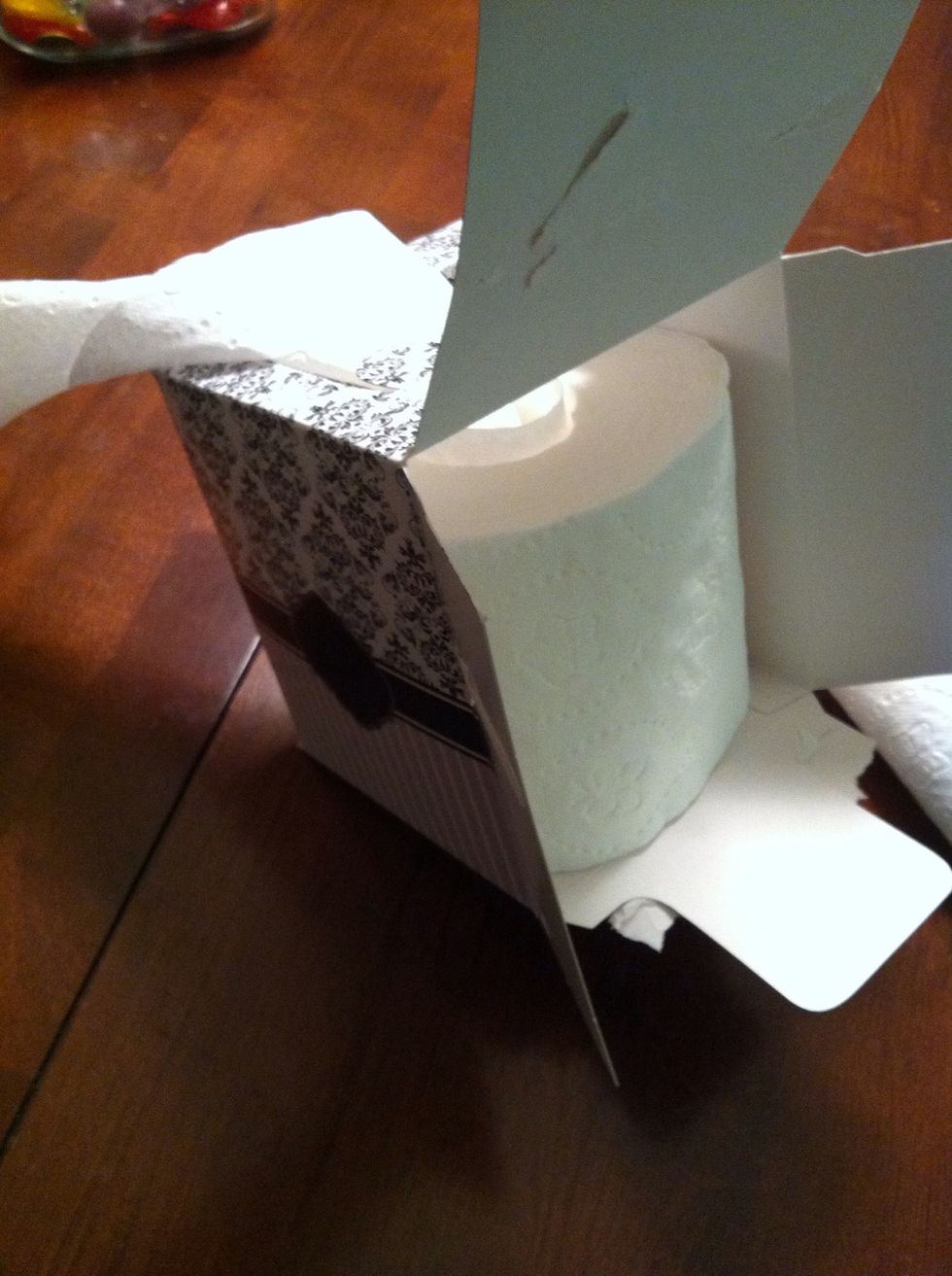 put tissue in box, threading through hole