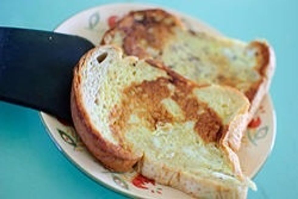 Put toast on plate and serve with syrup, powdered sugar, etc. (serve while still hot)