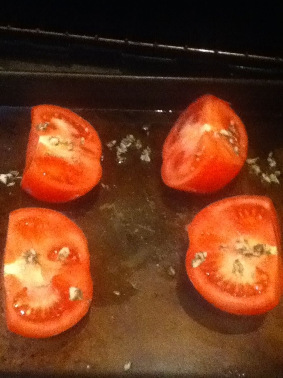 Put tomatoes cut sides up in an oiled small baking dish and drizzle with a third of garlic mixture. Roast until tender, 30 to 40 minutes.
