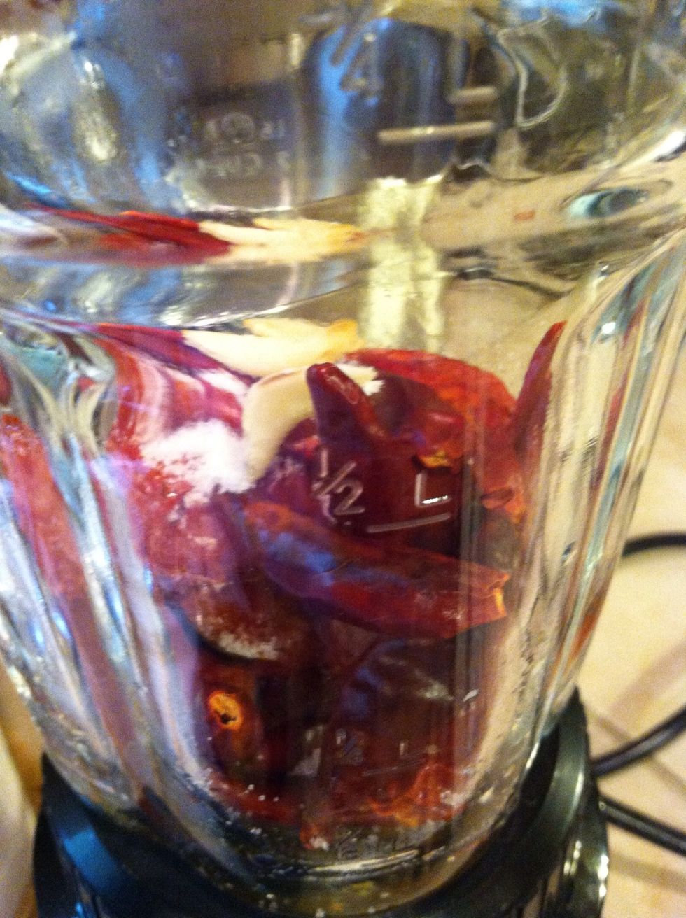 Put tomatoes, garlic, chiles, and salt to taste and blend together. If you blend and think consistency is too thick add a little water to get consistency of your choice.