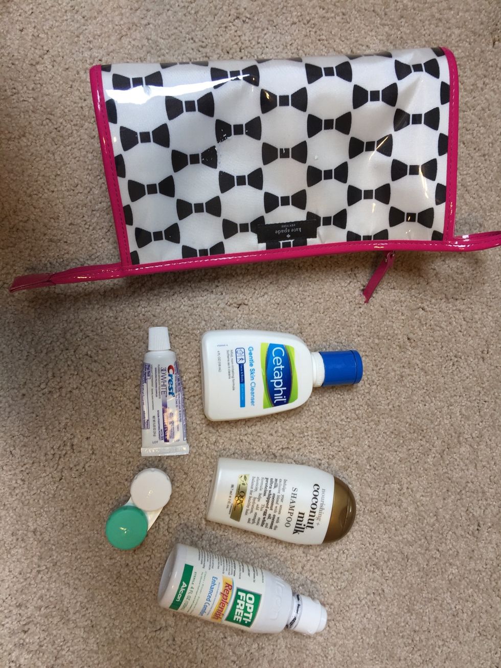 Put travel sized beauty items in a cosmetic pouch.