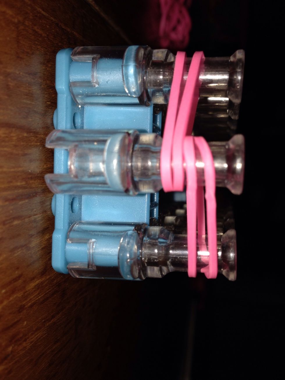 Put two bands from centre to left and then centre to right.