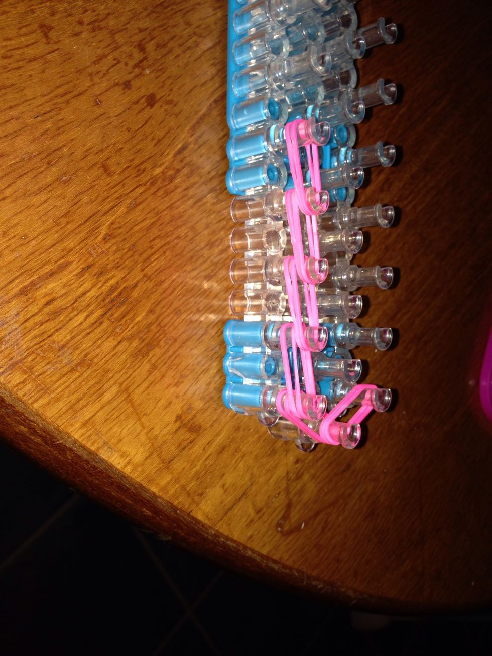 Put two bands on each and continue it four bands up.