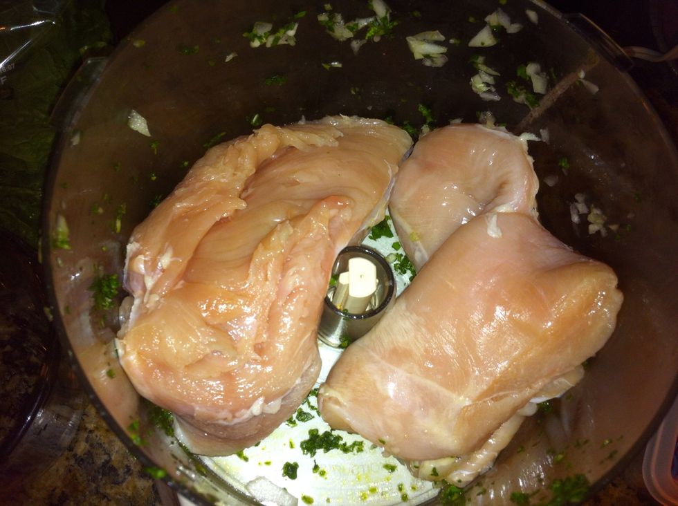 Put two large chicken breasts or 3 small ones in the food processor. Pulse until minced.