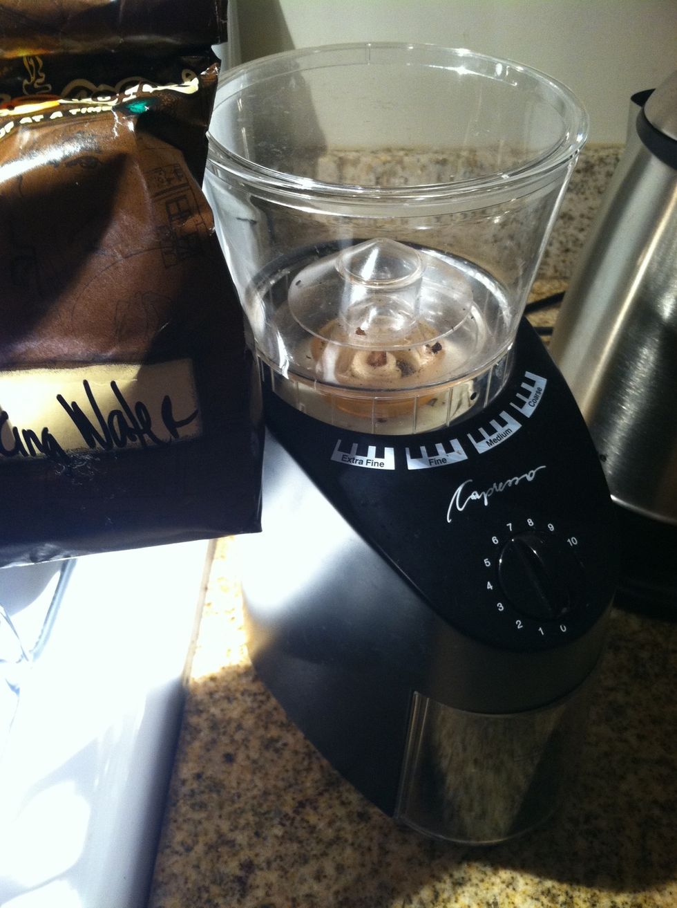 Put two tablespoons of beans in your burr mill and mill them to a medium-fine ground.