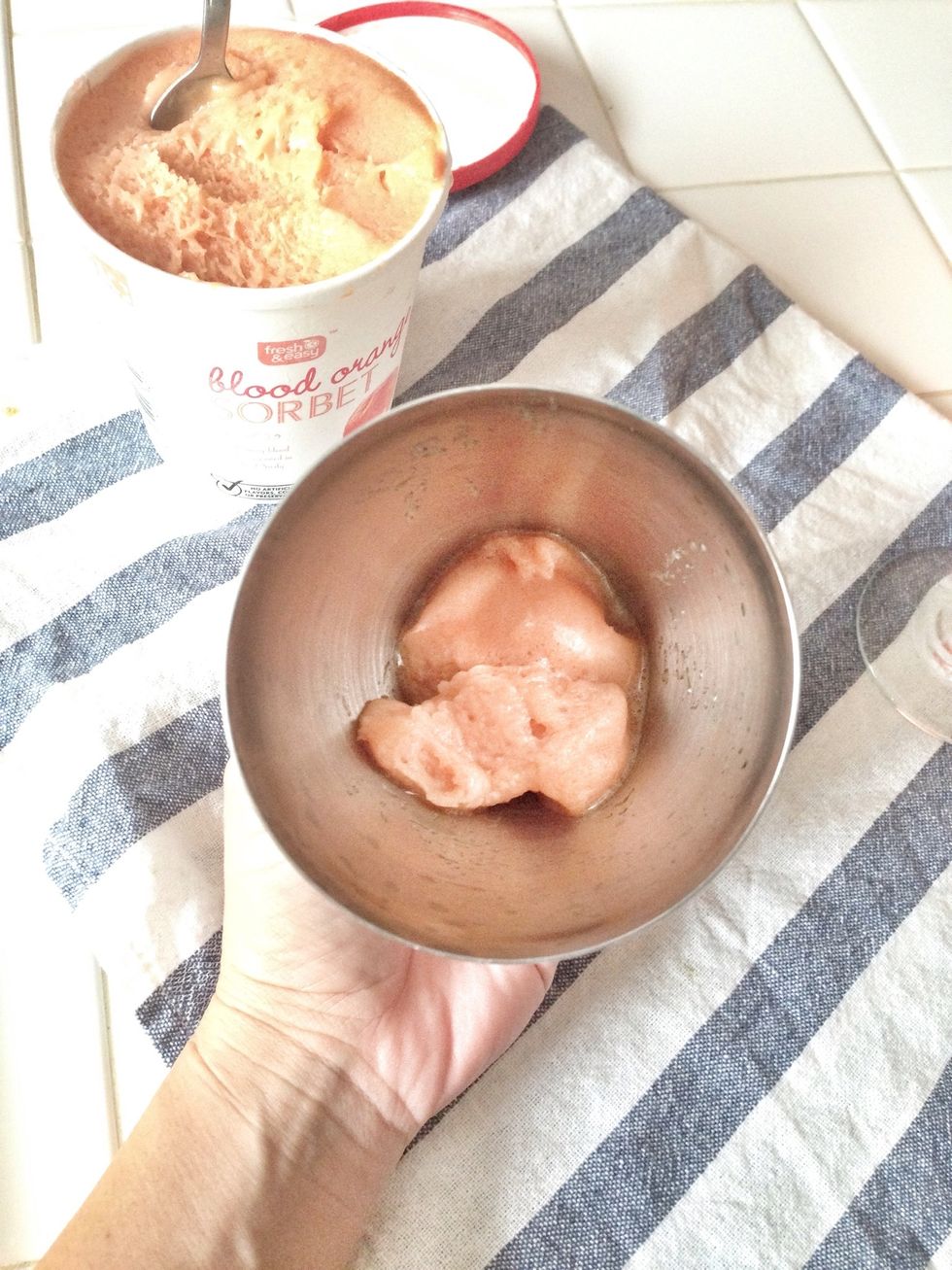 Put two tablespoons of sorbet in a cocktail shaker.