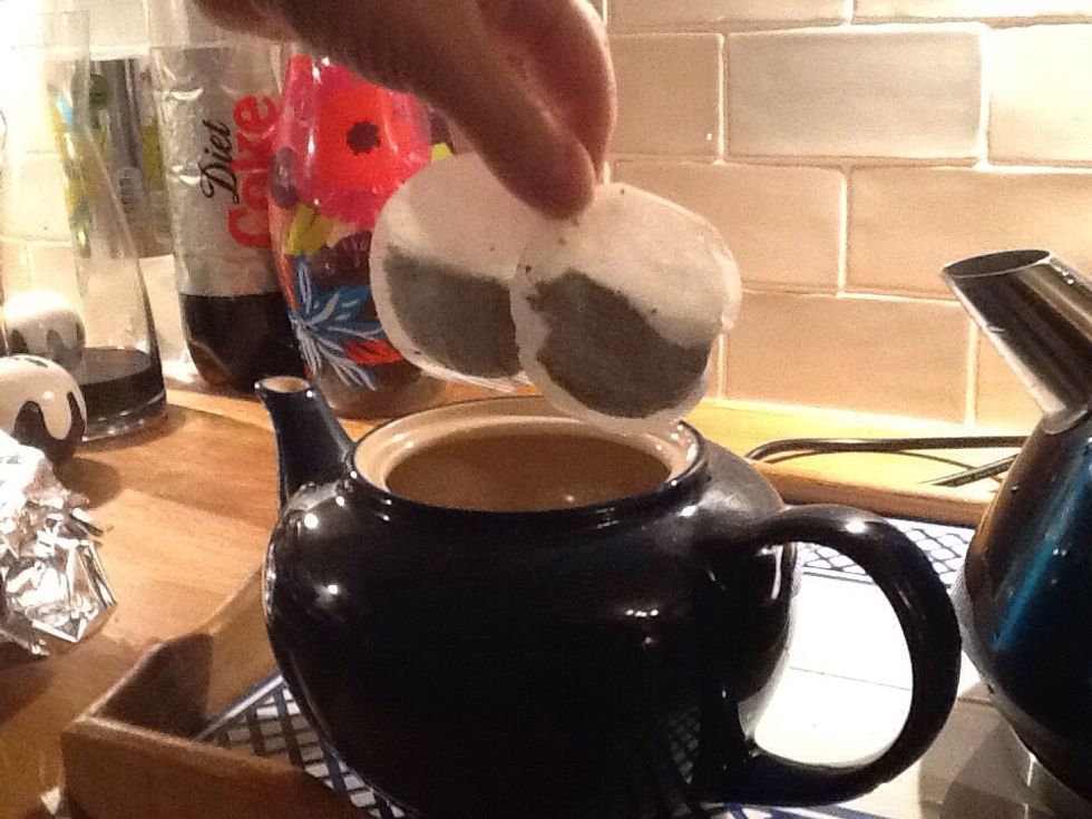 Put two tea bags into the tea pot.