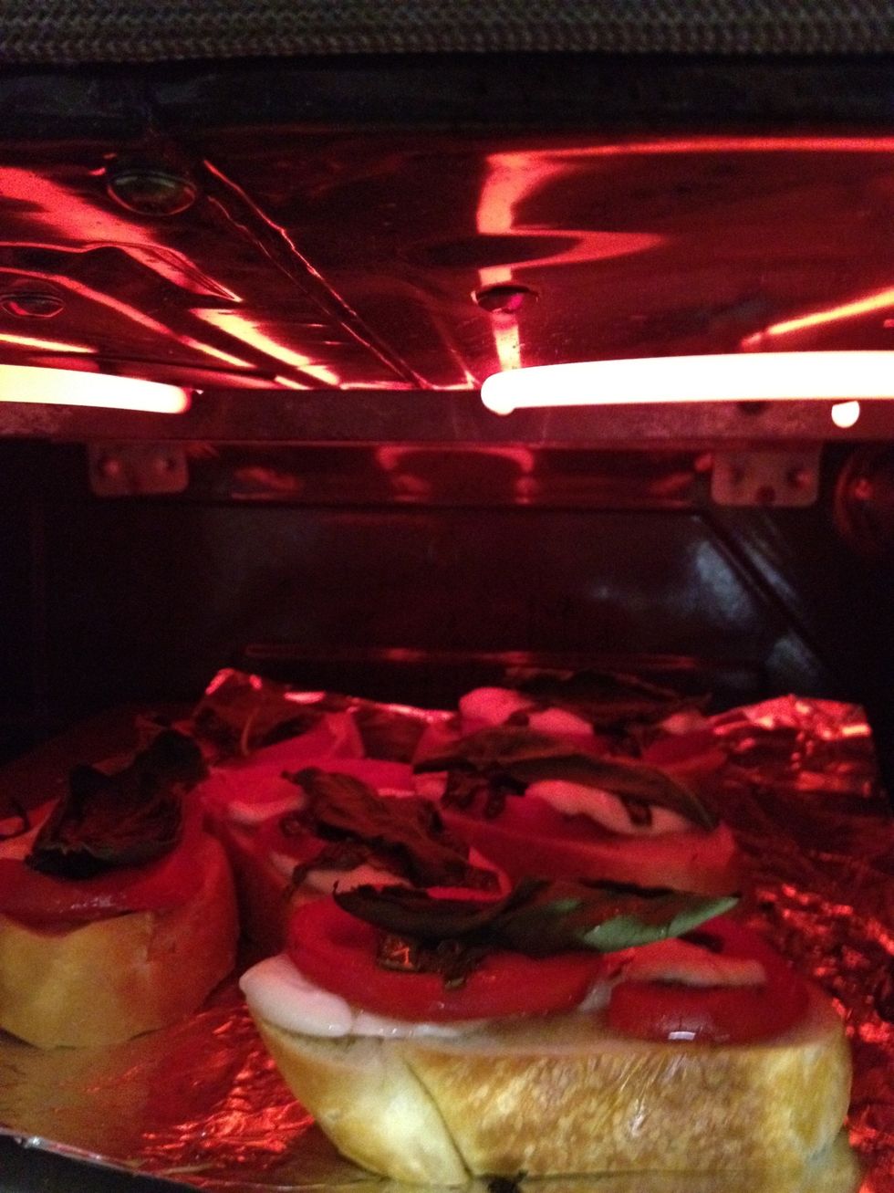 Put under the broiler with the oven door slightly open to watch as the cheese begins to melt and the edges turn brown.