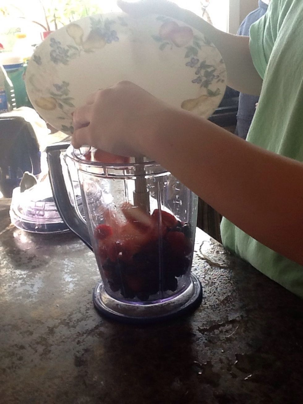 Put washed fruit into the blender.