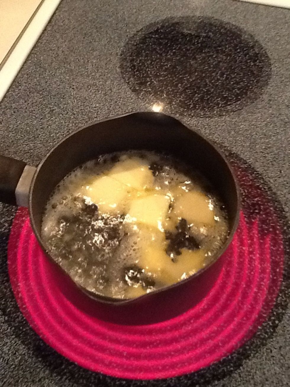 Put water and butter in a pot and turn to medium high heat. When butter is melted, remove from heat.