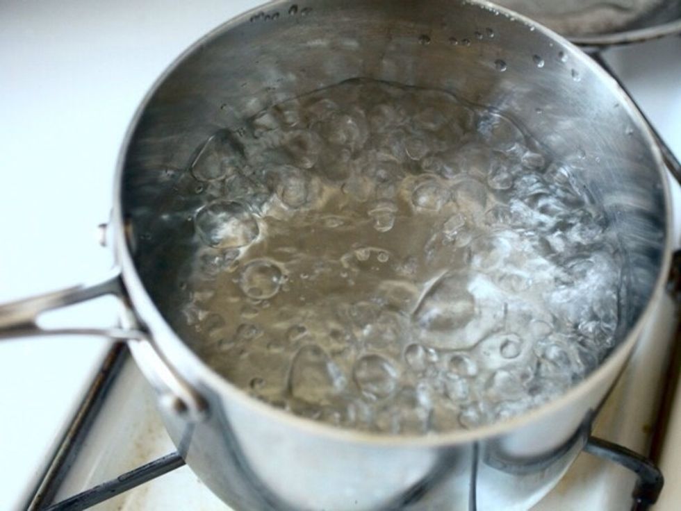 Put water in a pot and let it boil