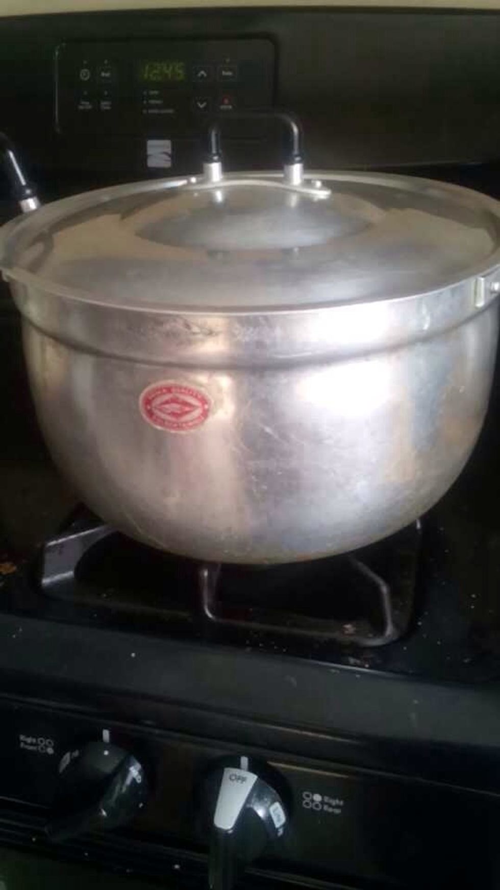 Put water in the pot, cover it and set it on the stove. Put the stove on high.
