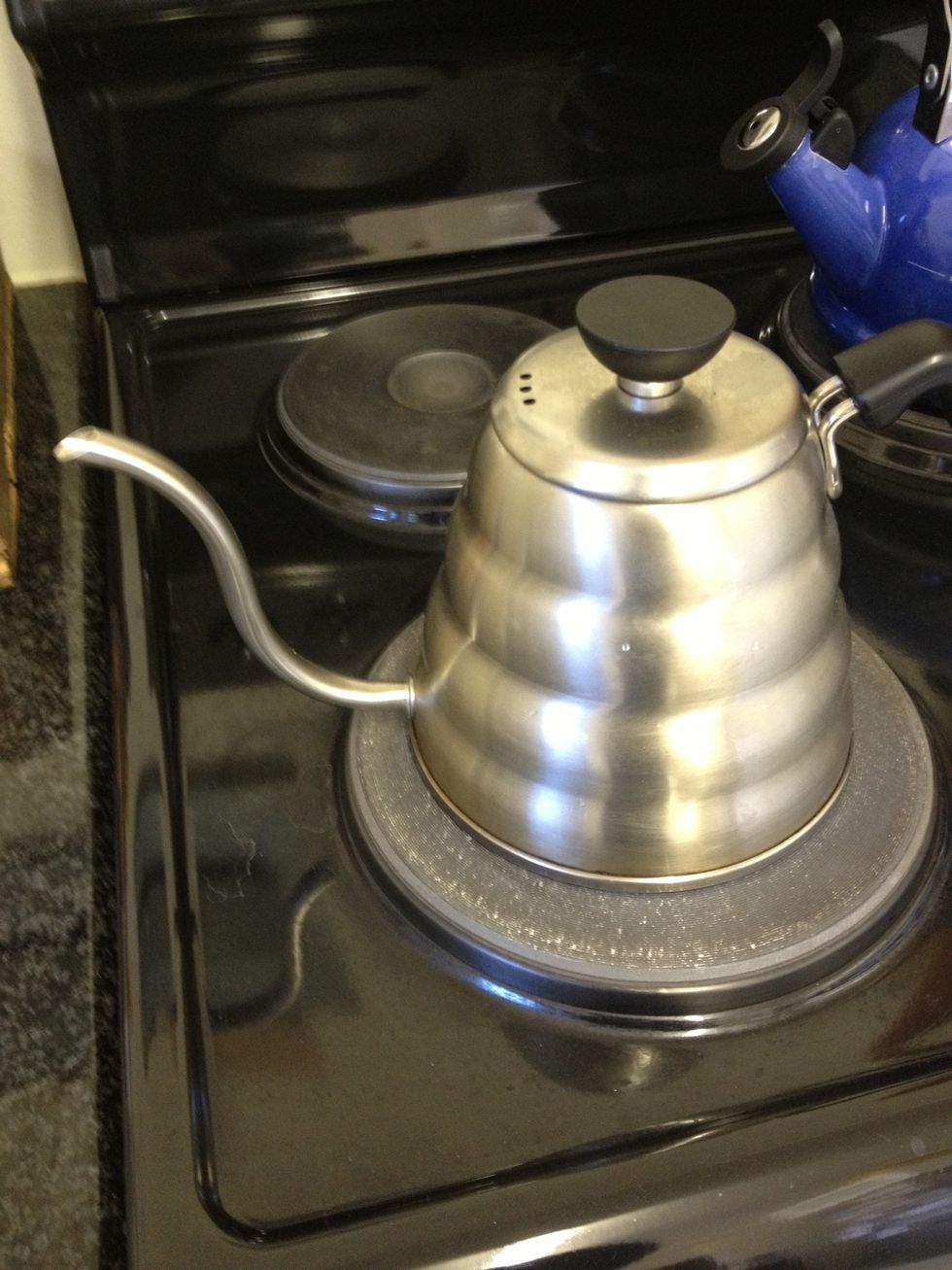 Put water on heat and wait for it to boil. You can also fill your pouring kettle with pre-boiled water.