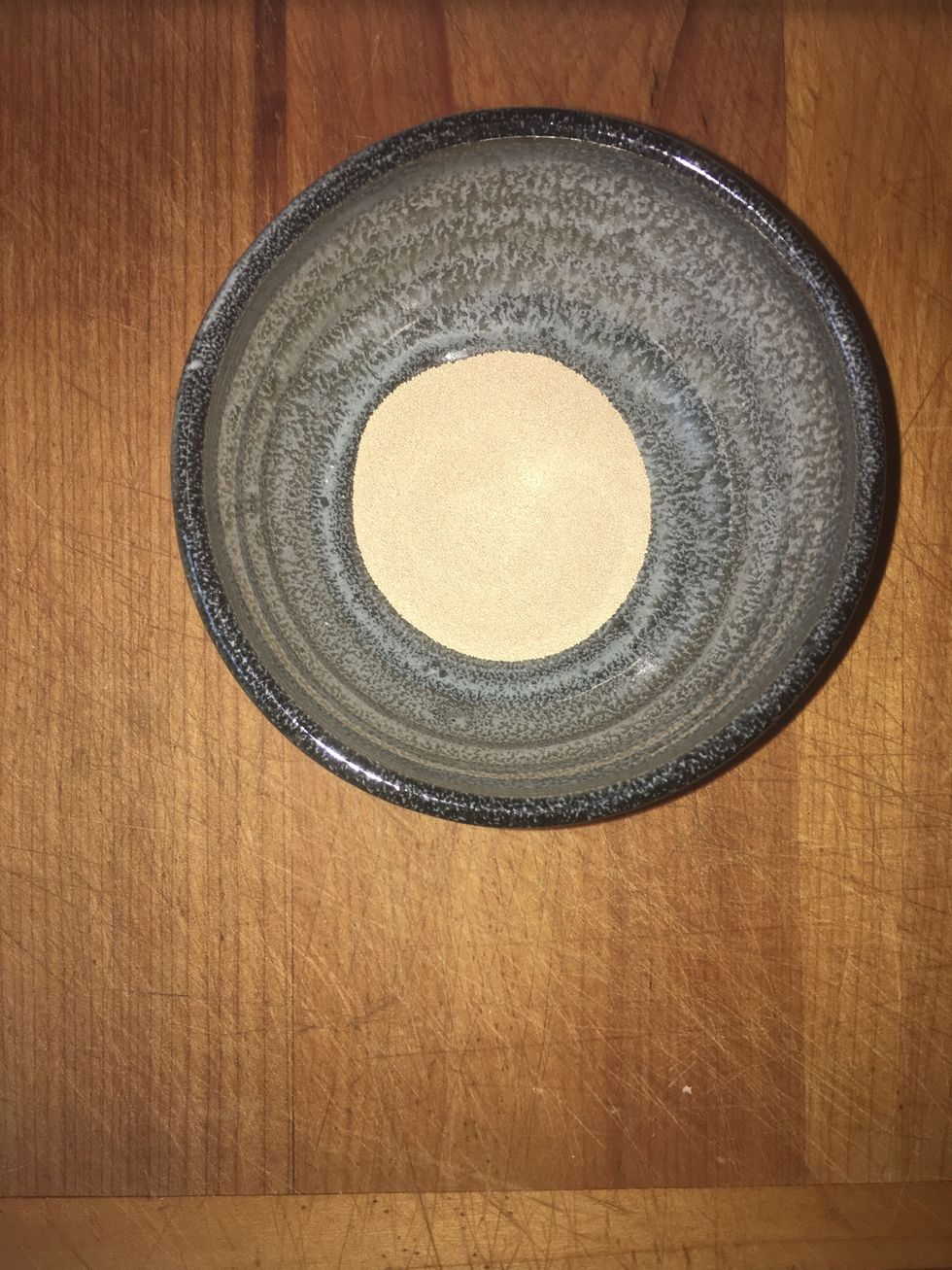 Put yeast in a bowl or cup