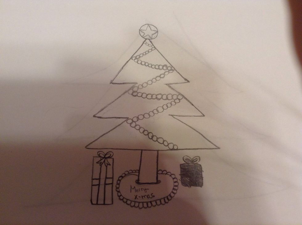 Put you peice of paper over the foil and start tracing with the tip of your pencil. I went for a Christmas look!!