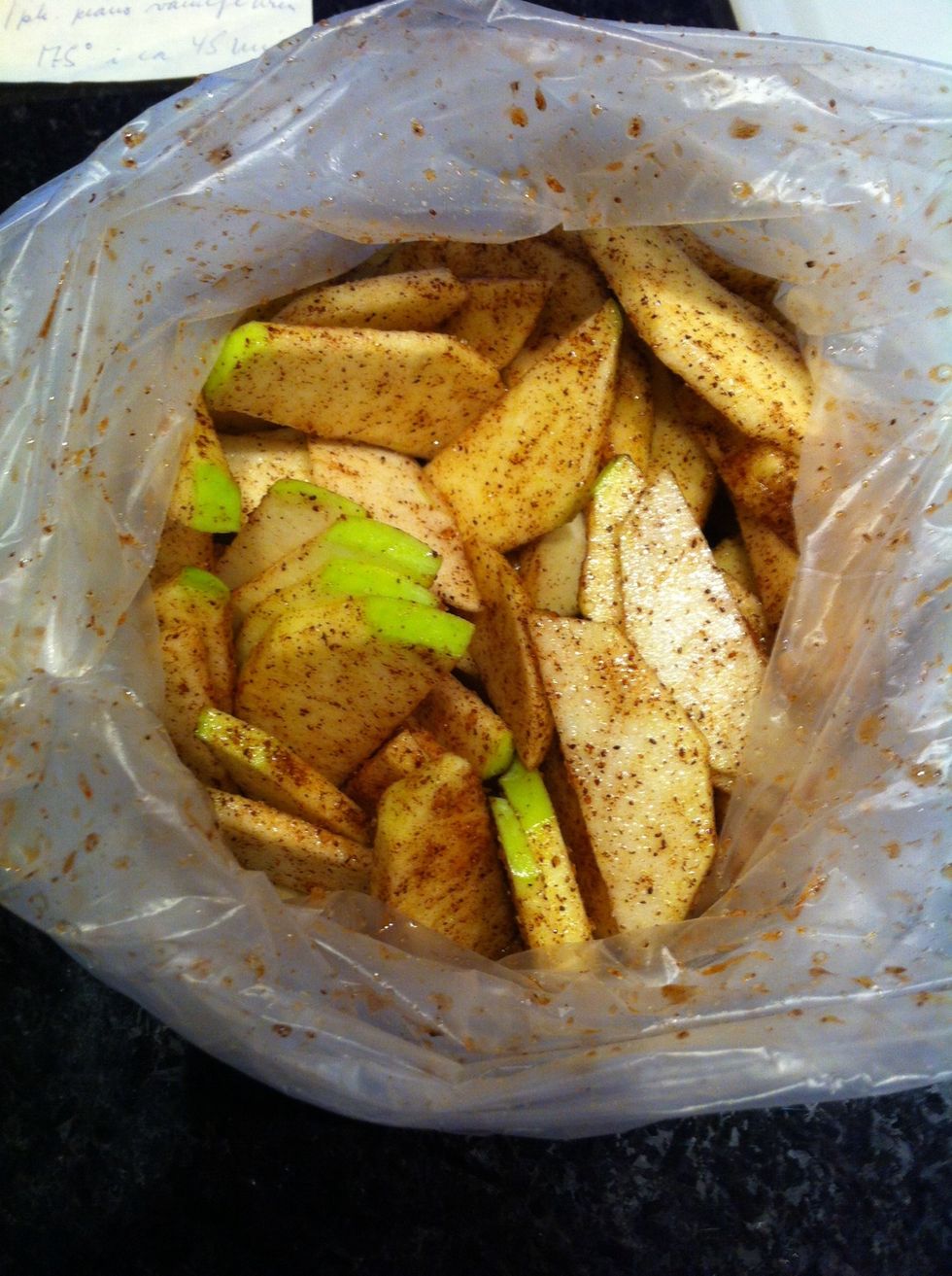 Put your appleslices in a plasticbag, and add sugar and cinamon. MIX!