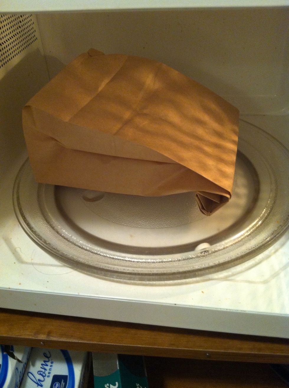 Put your bag in the microwave fold side down. Microwave around 2 minutes. Every microwave is different.
