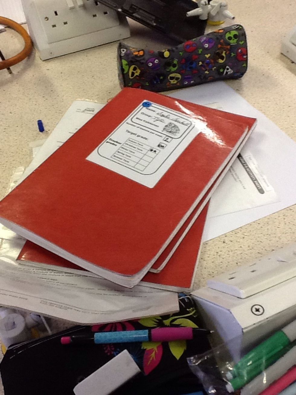 Put your books in the middle of the table in a pile,