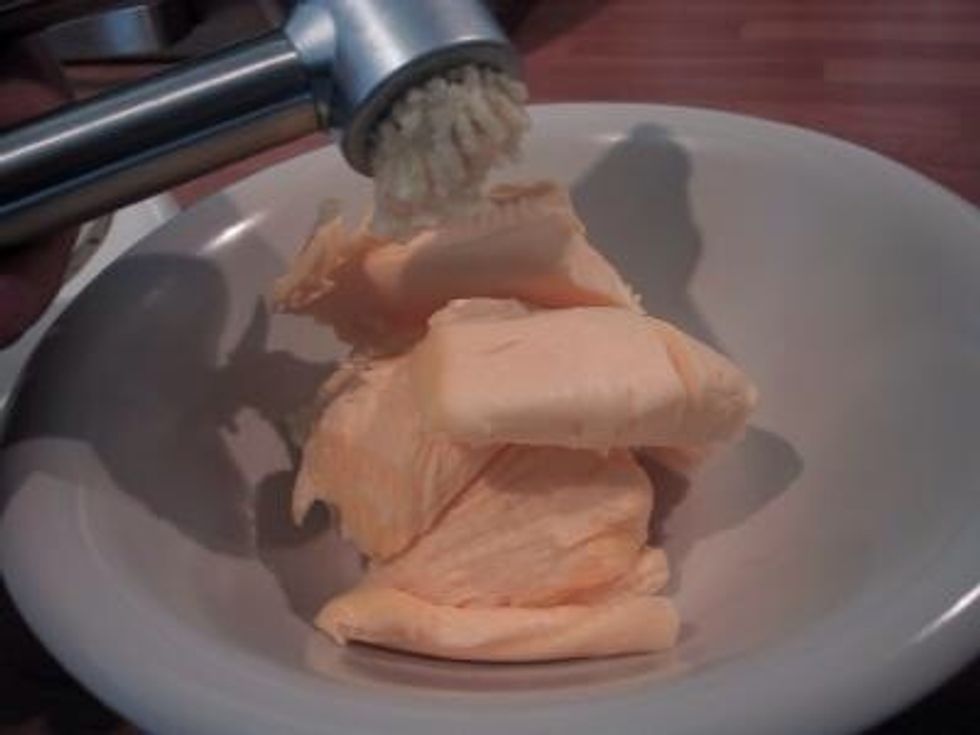 Put your butter into a dish and press the garlic onto the butter