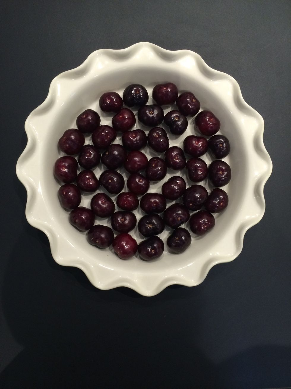 Put your cherries without taking out the stone. This is the traditional method. The kernels are supposed to diffuse a special flavor
