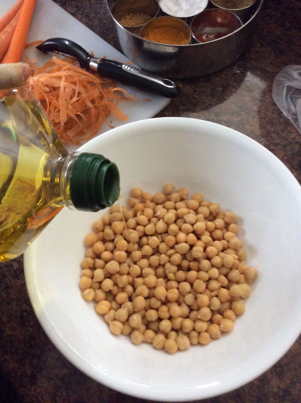 Put your chick peas into a large bowl and add a teaspoon of olive oil to your drained chick peas. Again there are 40 calories in a teaspoon of olive oil.