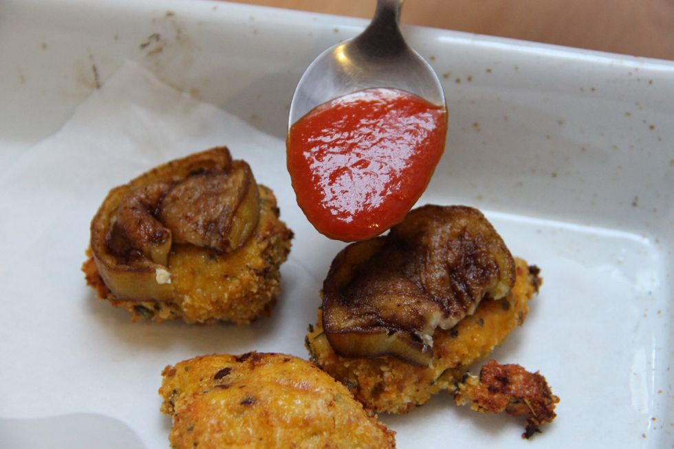 Put your chicken breaded in pan and add your deepfried eggplant and add a spoon of fresh tomato sauce