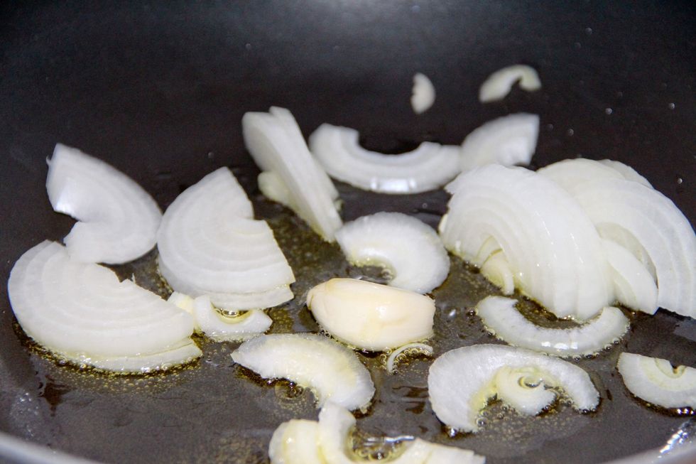 Put your chopped onions in a pan with olive oil and a clove of garlic and saut\u00e9.