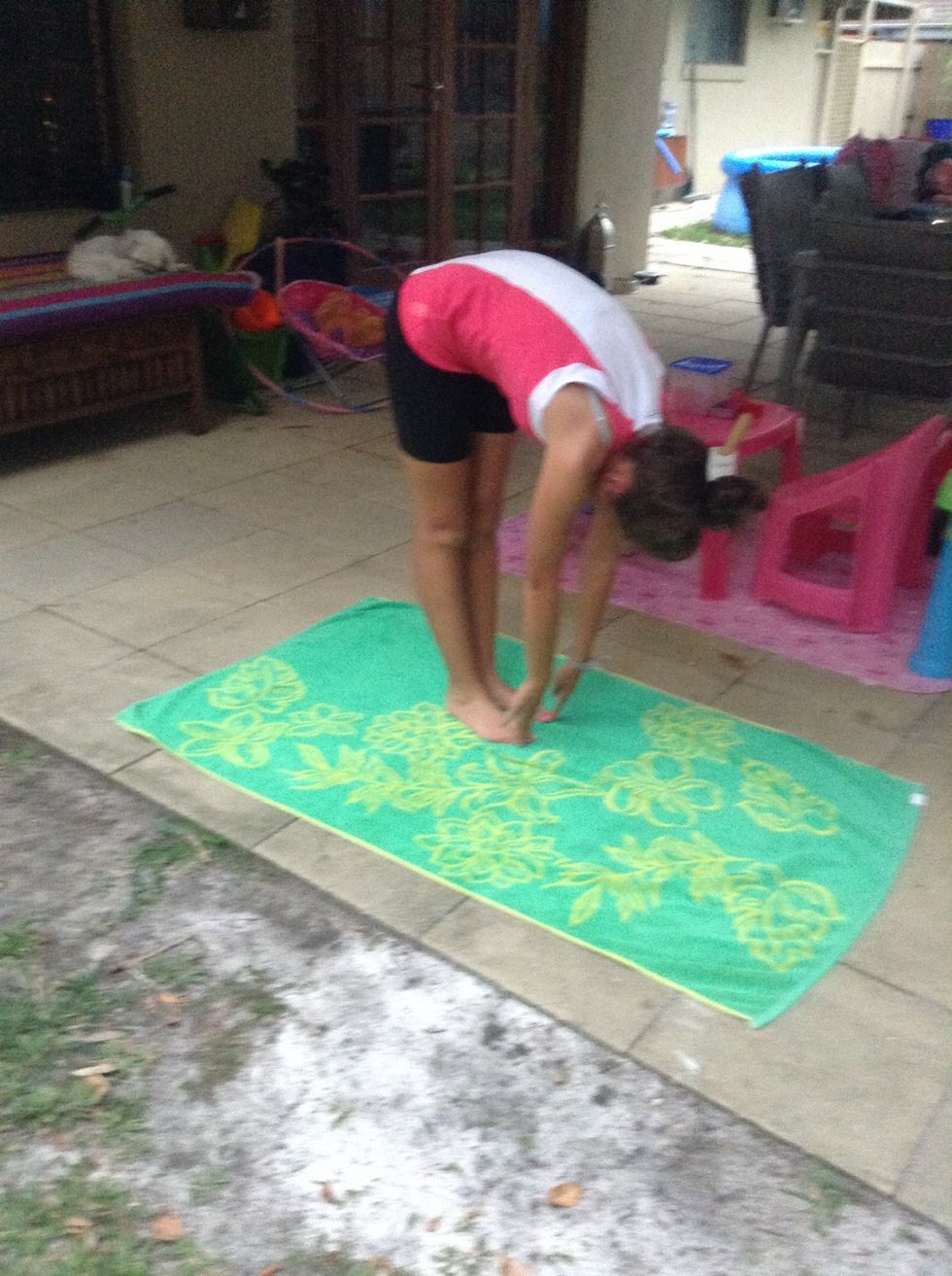 Put your feet together and bend down and touch your toes. Hold for 10 seconds.