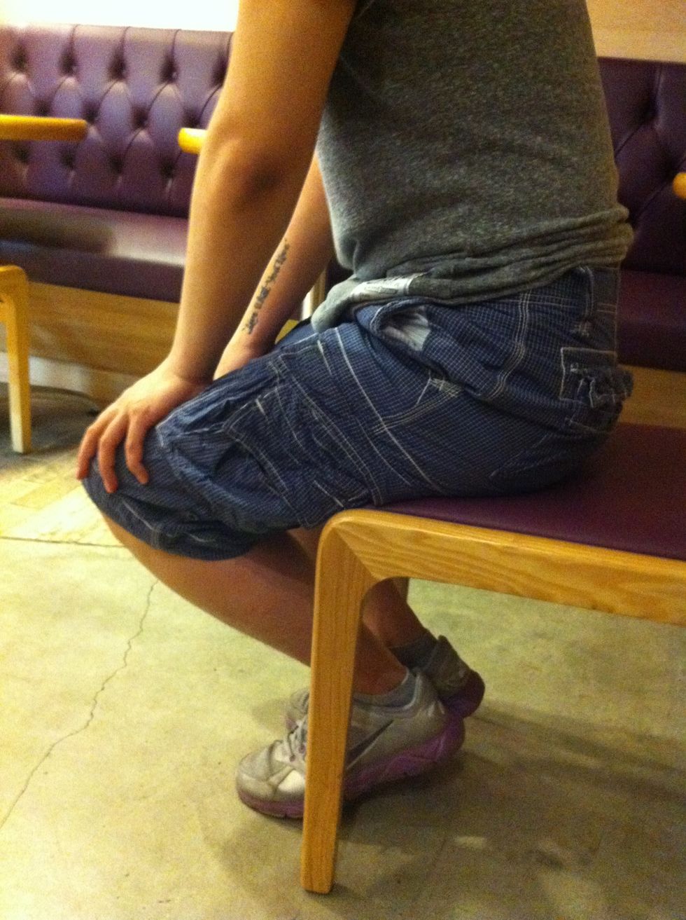 Put your feet under the chair slightly without your friend knowing.